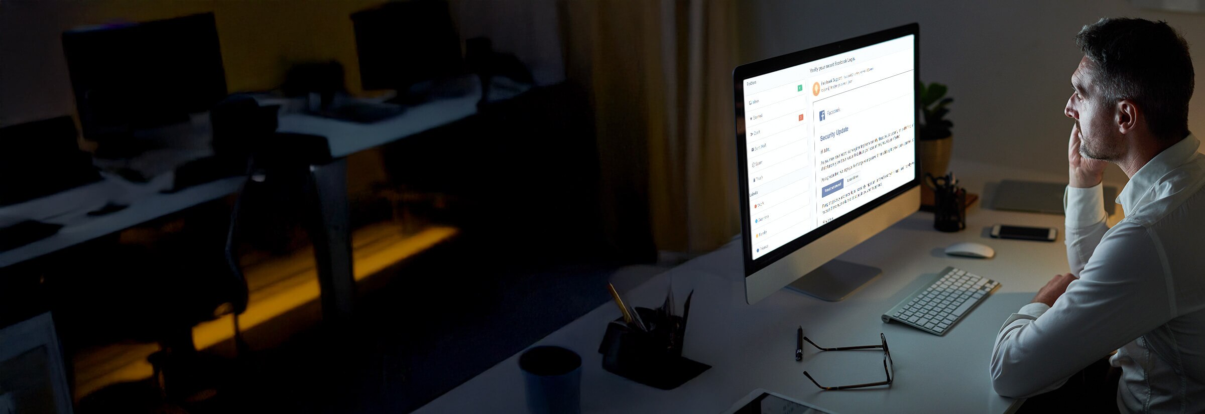 Image of a man discovering his email information is on the dark web.