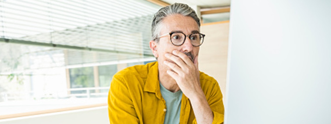 A person reading about how identity thieves could use their information.