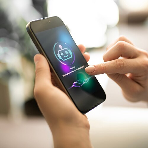 Person using an iPhone with a robot icon displayed, symbolizing data privacy in AI customer service.